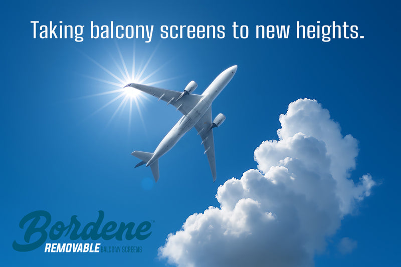 Airplane in the sky with clouds and the sun